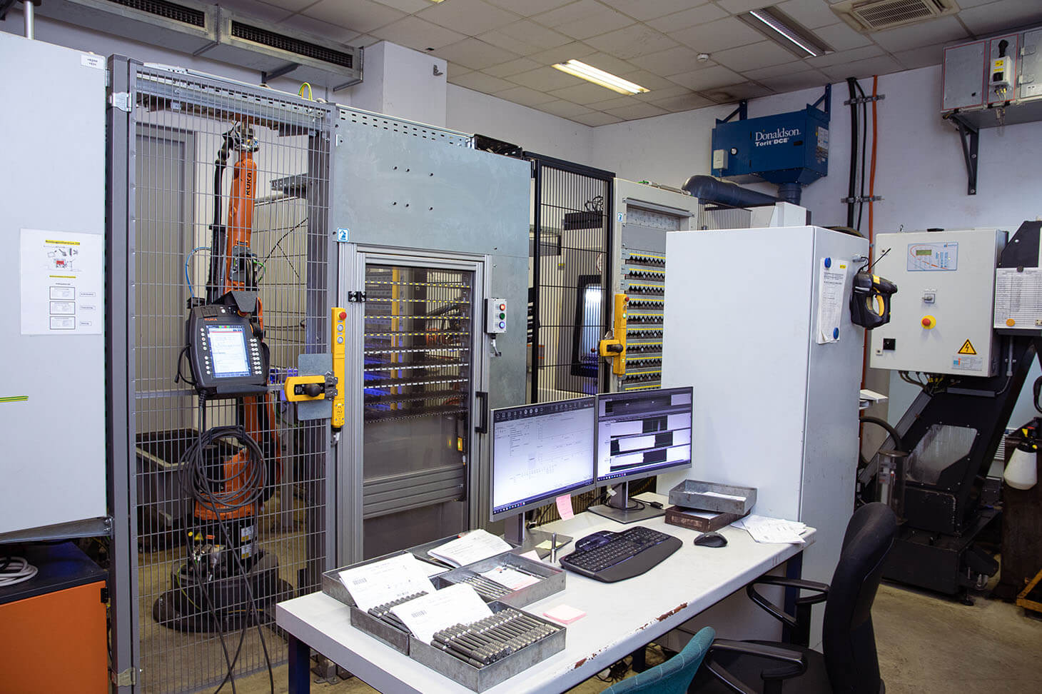 Interior view of voestalpine test facility with samples at the desk