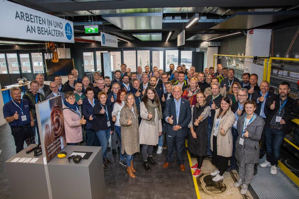 Group photo of participants in a voestalpine occupational safety training course