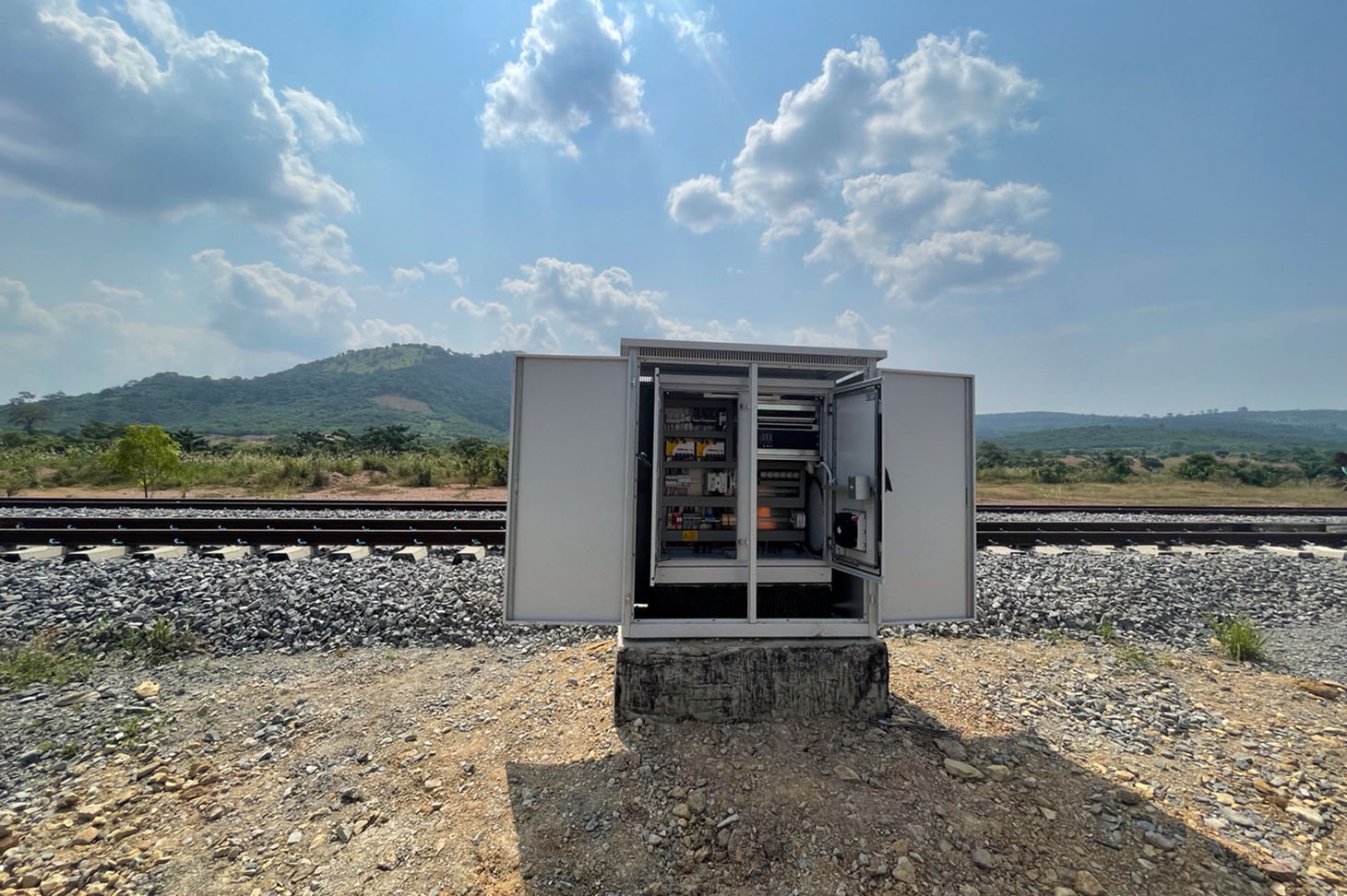 Control technology container from the voestalpine Railway Systems Group placed next to a Railway in Africa.